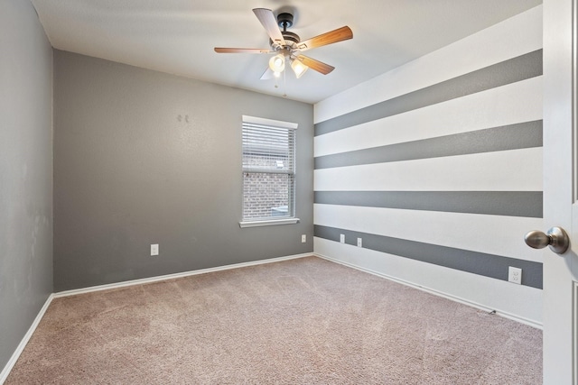 empty room with carpet floors and ceiling fan