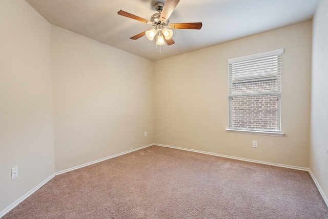 spare room with carpet and ceiling fan