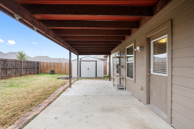 view of patio with a storage shed