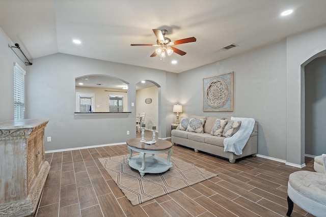 living room with vaulted ceiling and ceiling fan