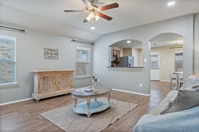 living room with lofted ceiling and ceiling fan