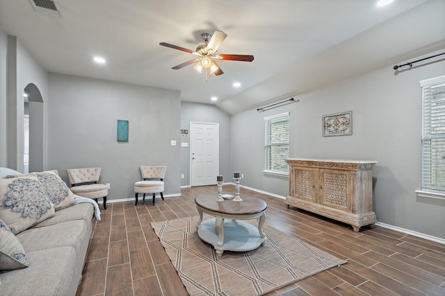 living room featuring lofted ceiling and ceiling fan