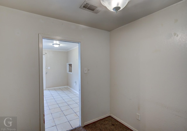 unfurnished room featuring light tile patterned floors