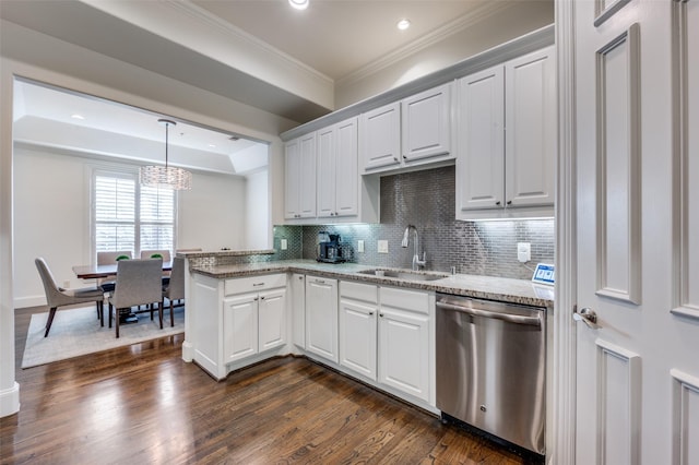 kitchen with stainless steel dishwasher, sink, and white cabinets