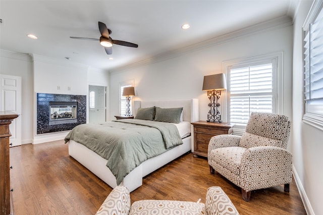 bedroom featuring ornamental molding and dark hardwood / wood-style floors