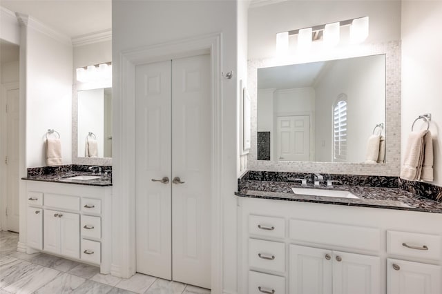 bathroom with vanity, crown molding, and decorative backsplash