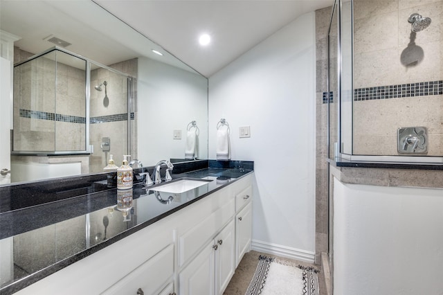 bathroom with vanity, lofted ceiling, and an enclosed shower