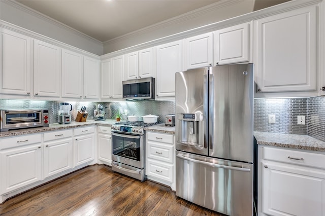 kitchen with white cabinetry, backsplash, dark hardwood / wood-style flooring, and stainless steel appliances