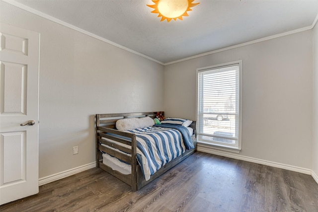 bedroom featuring ornamental molding and dark hardwood / wood-style flooring