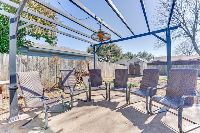 view of patio with ceiling fan, a pergola, and a shed