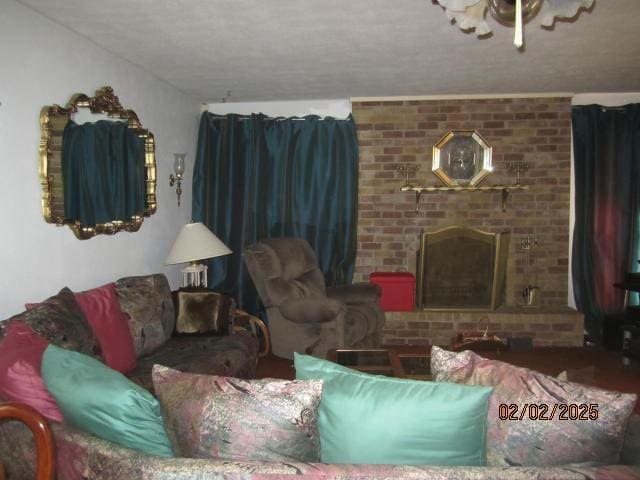 living room featuring a brick fireplace