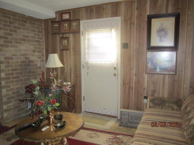 living room with wood walls