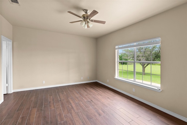 unfurnished room with dark wood-type flooring and ceiling fan