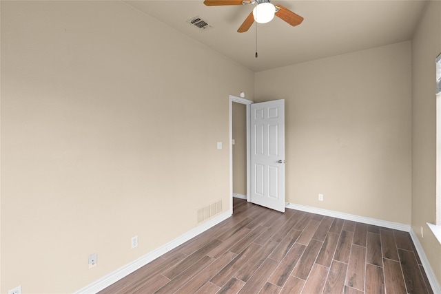 empty room featuring wood-type flooring and ceiling fan