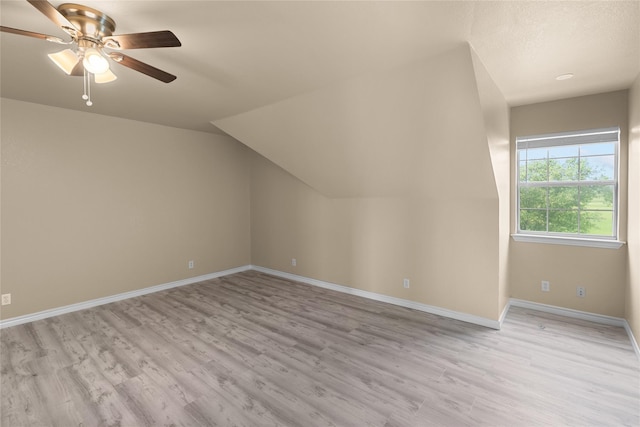 bonus room featuring vaulted ceiling, ceiling fan, and light wood-type flooring