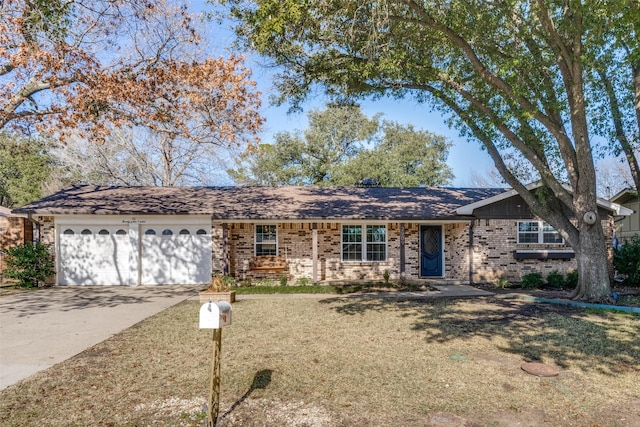 ranch-style home featuring a garage and a front yard