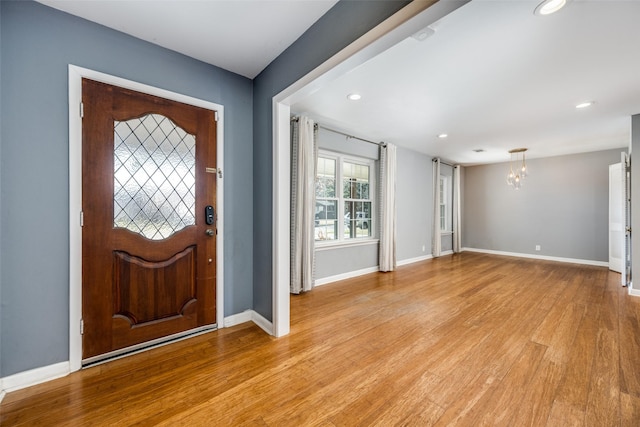 foyer featuring a chandelier and light wood-type flooring