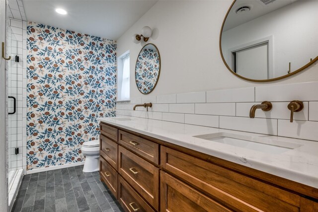 bathroom with vanity, tile walls, an enclosed shower, and toilet