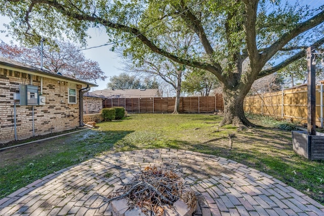 view of yard featuring a patio area and a fire pit