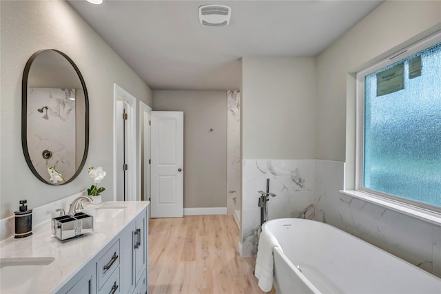 bathroom featuring vanity, separate shower and tub, wood-type flooring, and tile walls