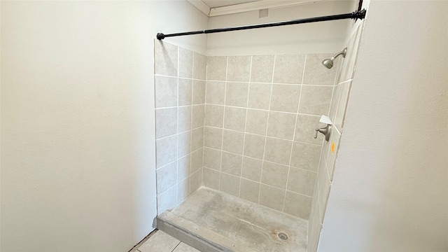 bathroom with a tile shower