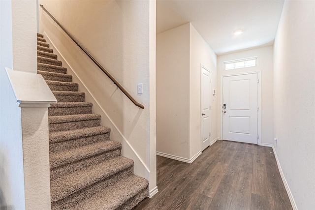 entryway with dark wood-type flooring