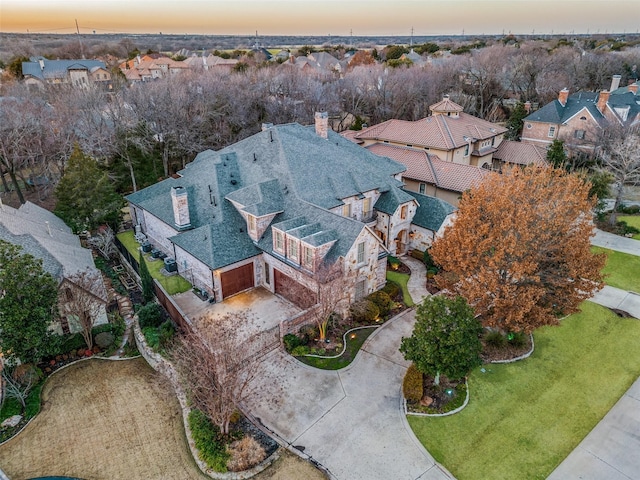 aerial view at dusk with a residential view