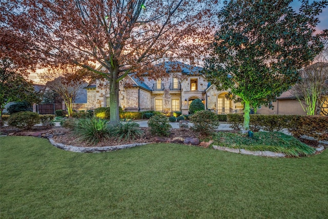 45 Dunrobin, Richardson, TX 75082 - view of front of home with stone siding and a front yard
