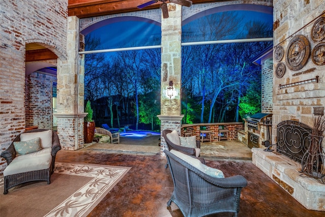 view of patio with ceiling fan and area for grilling