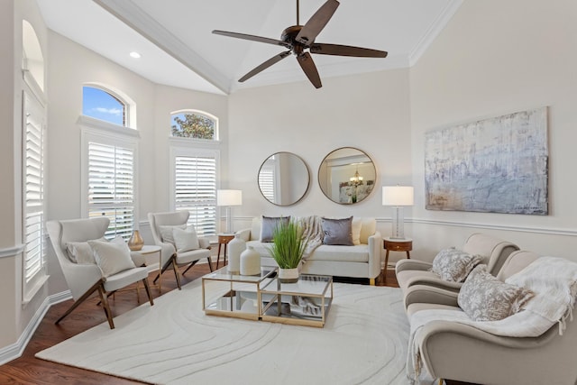 living room featuring ceiling fan, ornamental molding, and dark hardwood / wood-style floors