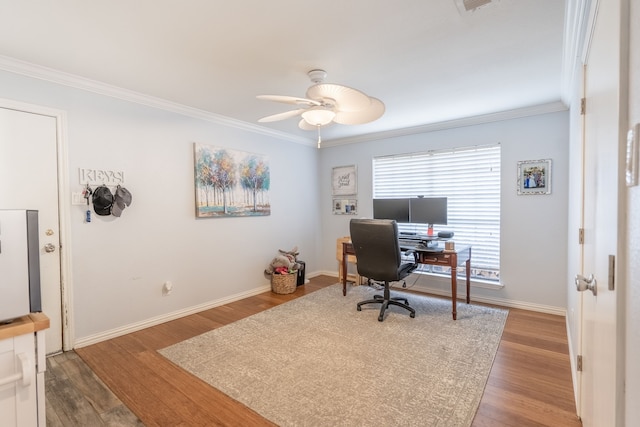 office area with wood-type flooring, ornamental molding, and ceiling fan