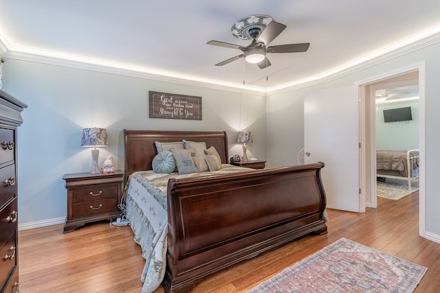 bedroom with ornamental molding, ceiling fan, and light hardwood / wood-style floors