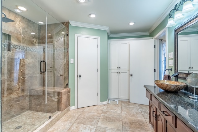 bathroom featuring crown molding, an enclosed shower, and vanity