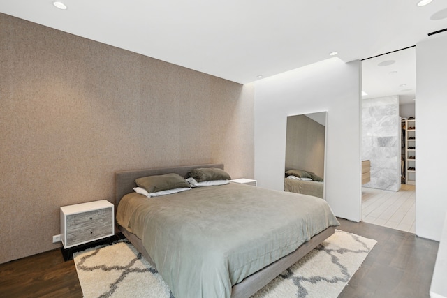 bedroom featuring dark hardwood / wood-style flooring