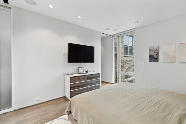 bedroom featuring light wood-type flooring