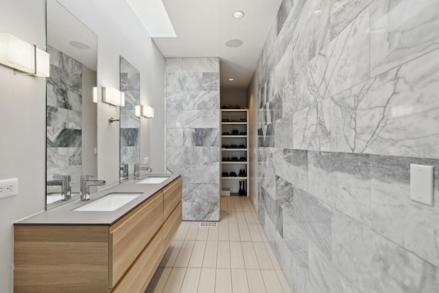 bathroom featuring vanity, tile walls, and tile patterned floors