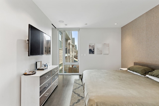 bedroom with dark wood-type flooring