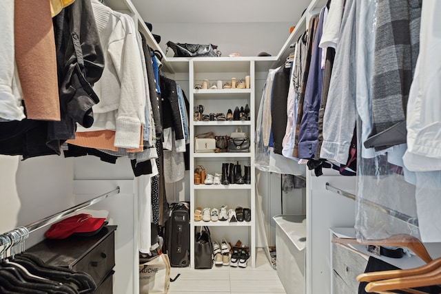 spacious closet with light tile patterned flooring