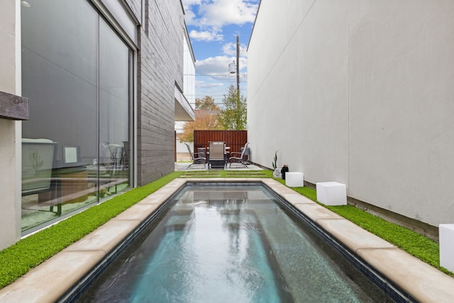 view of swimming pool featuring a patio area