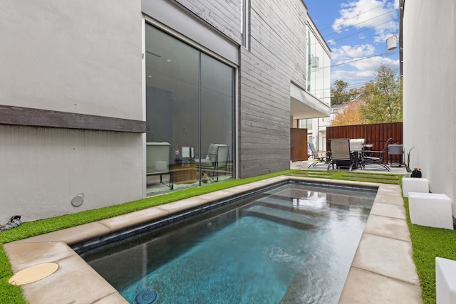 view of pool featuring a patio