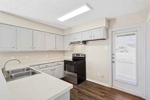 kitchen featuring range with electric stovetop, sink, dark wood-type flooring, and a textured ceiling