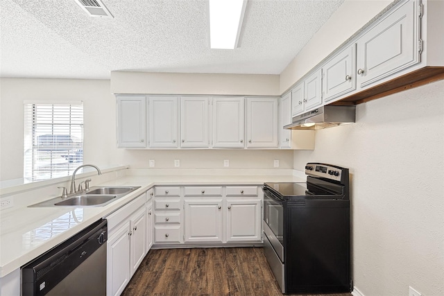 kitchen featuring sink, white cabinets, dark hardwood / wood-style flooring, stainless steel appliances, and a textured ceiling