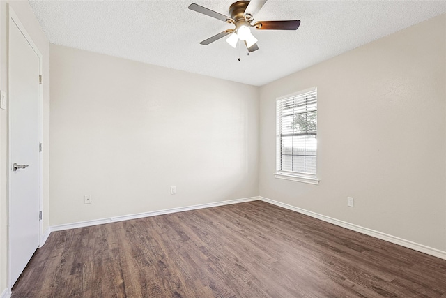 unfurnished room featuring ceiling fan, dark wood-type flooring, and a textured ceiling