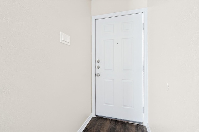 doorway with dark hardwood / wood-style flooring