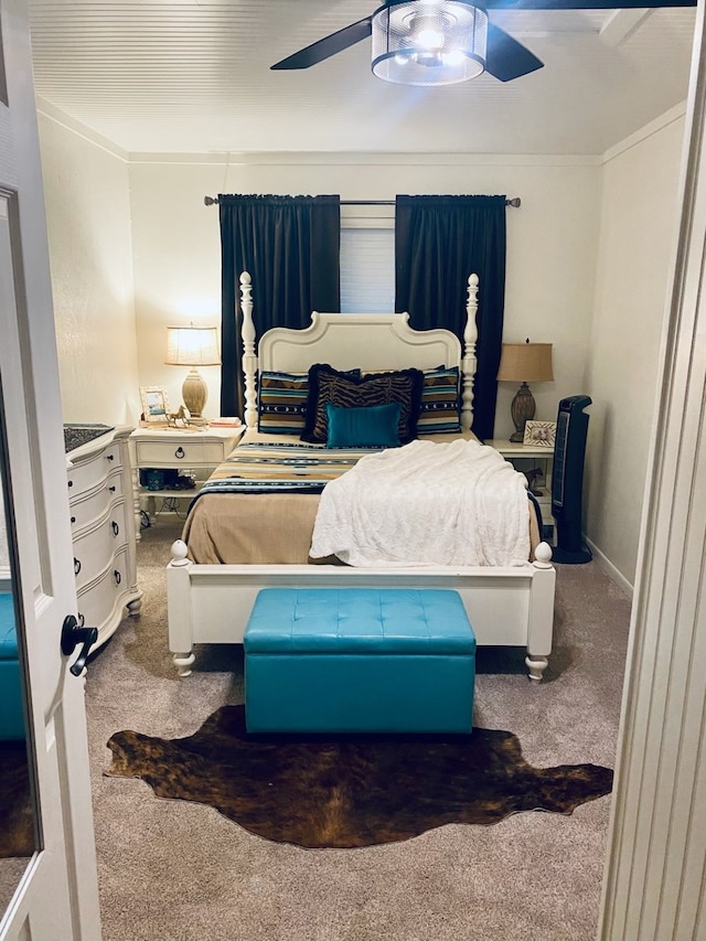 bedroom with ceiling fan and carpet