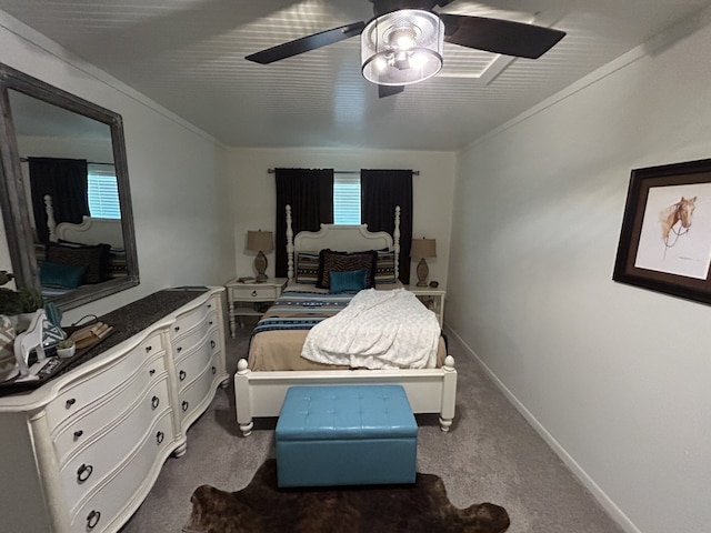 bedroom featuring multiple windows, ceiling fan, and carpet