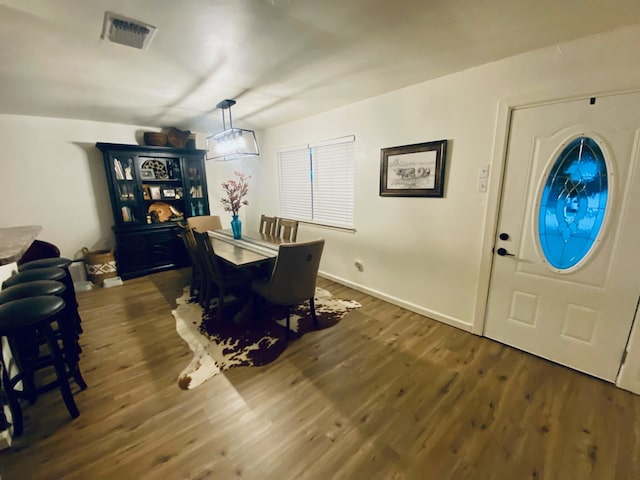 dining area featuring dark hardwood / wood-style floors