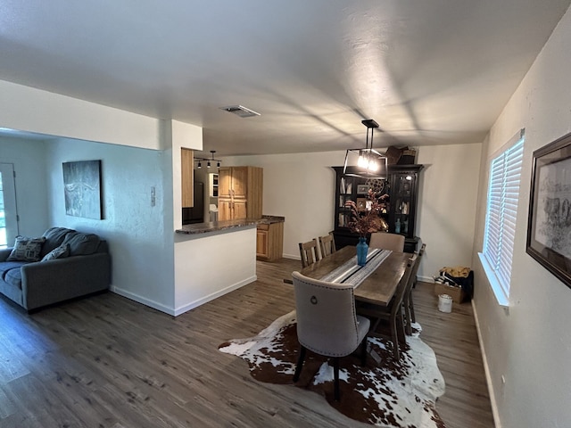 dining room featuring dark wood-type flooring