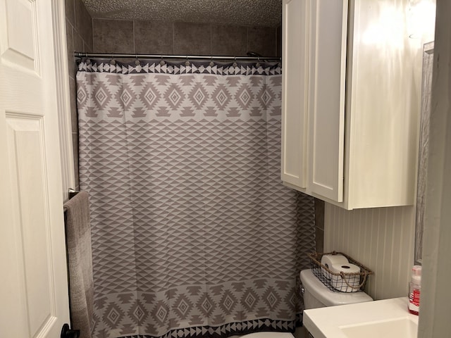 bathroom with vanity, a shower with curtain, and toilet