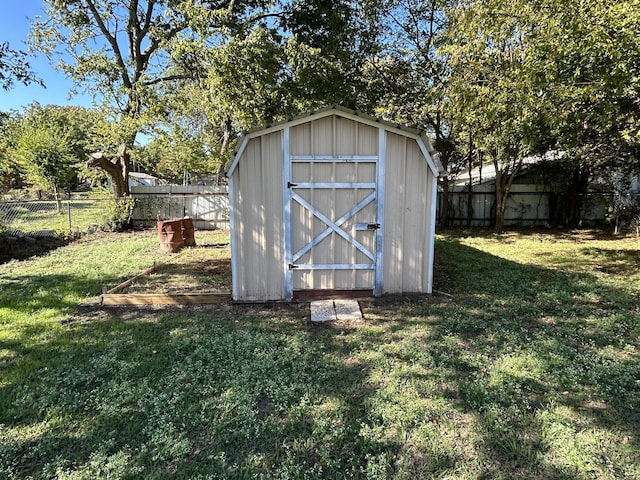 view of outdoor structure with a lawn